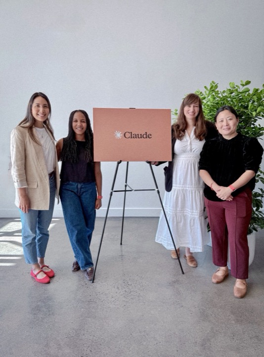 Sarah Forrest with collaborators at a Claude event